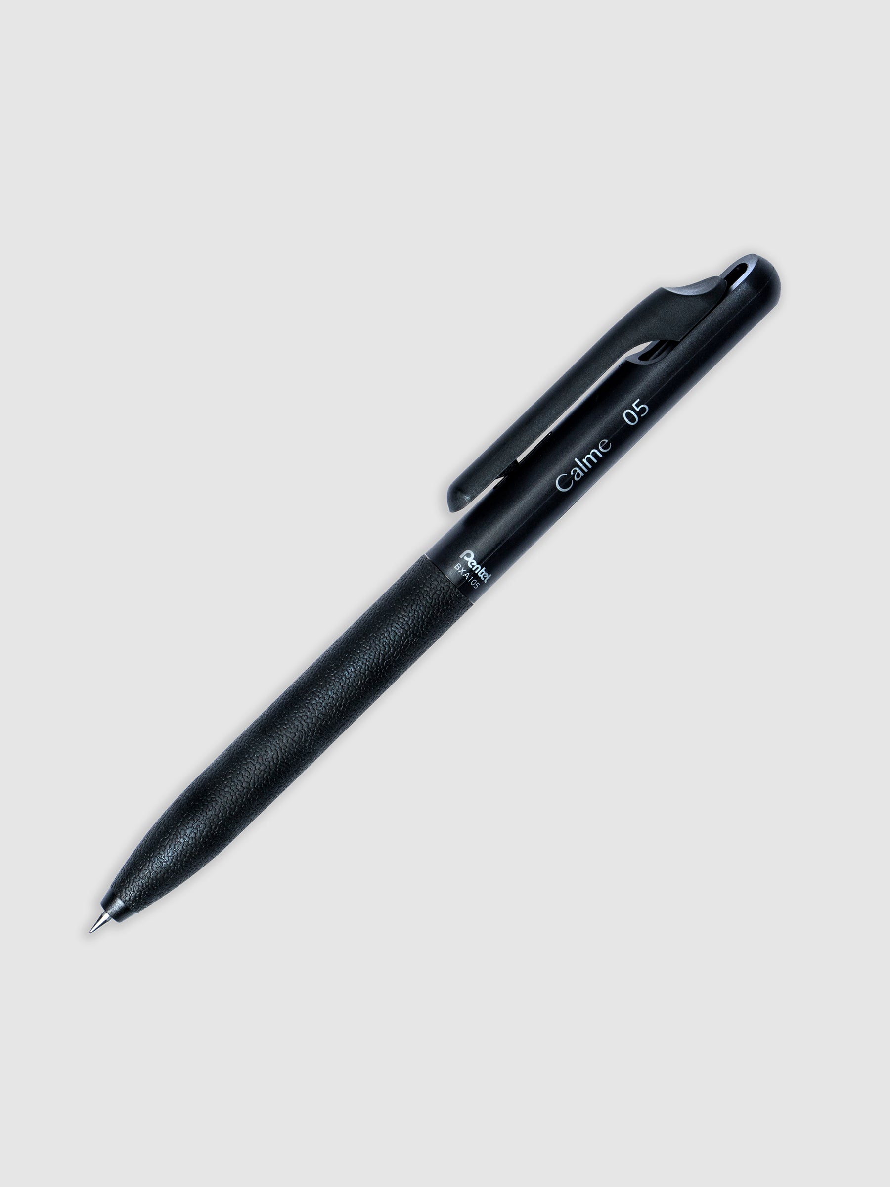 Black pen turned to the right against a neutral background.