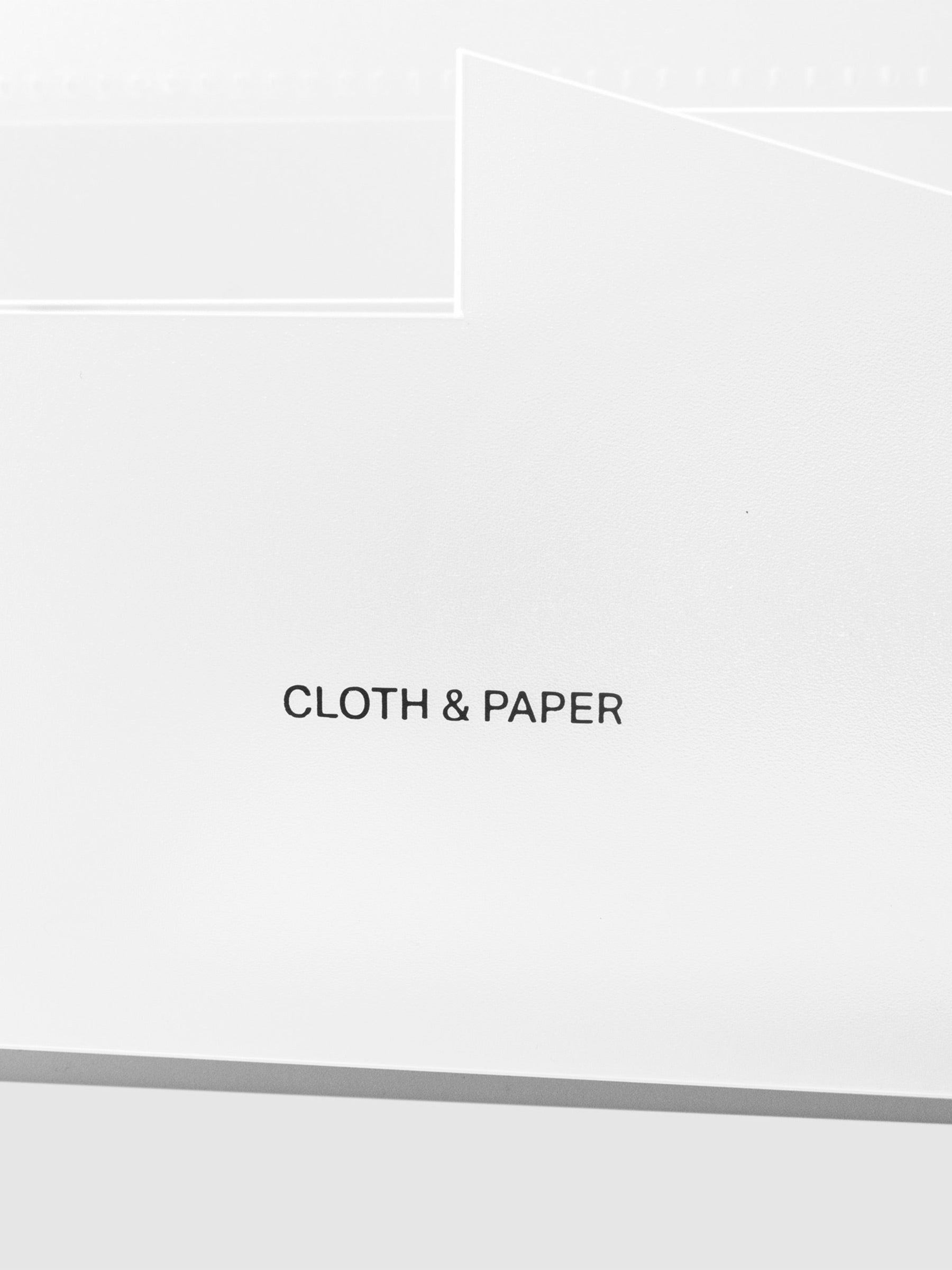 Closeup of Cloth and Paper logo printed on caddy.