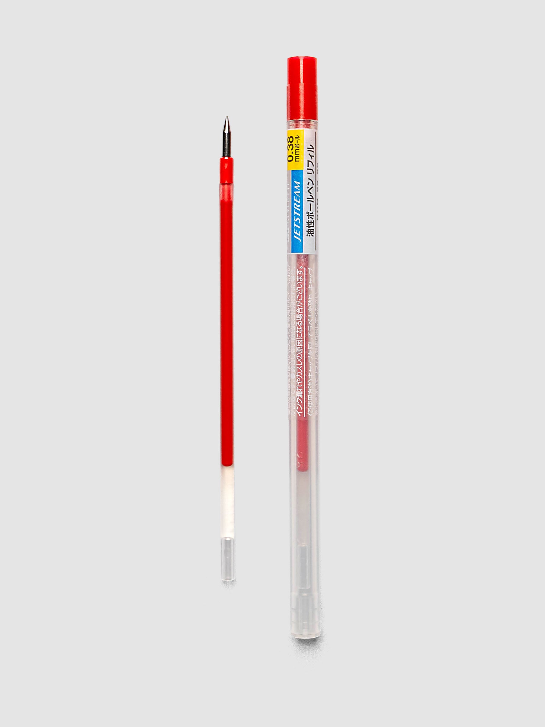 Uni-ball SXR-89-38 Style Fit Jetstream Pen Refill in red shown next to packaged tube with printed label