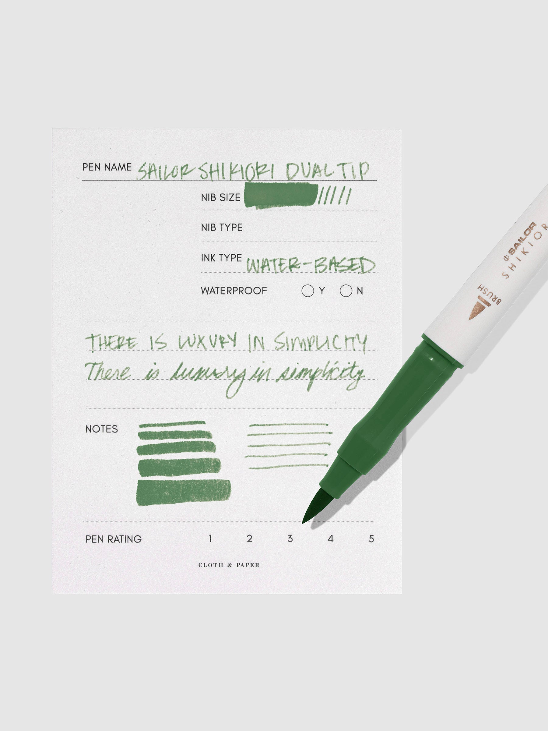 Pen displayed next to in use pen test sheet. Color pictured is Tokiwamatsu. 