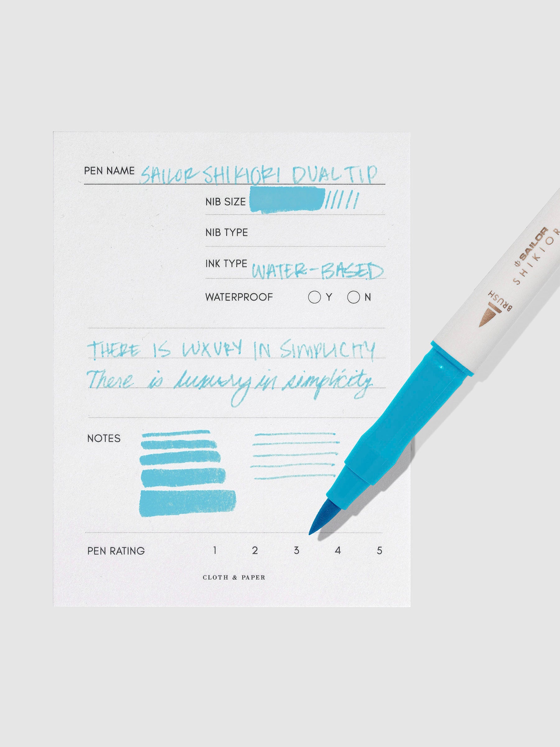 Pen displayed next to in use pen test sheet. Color pictured is Yukiakari. 