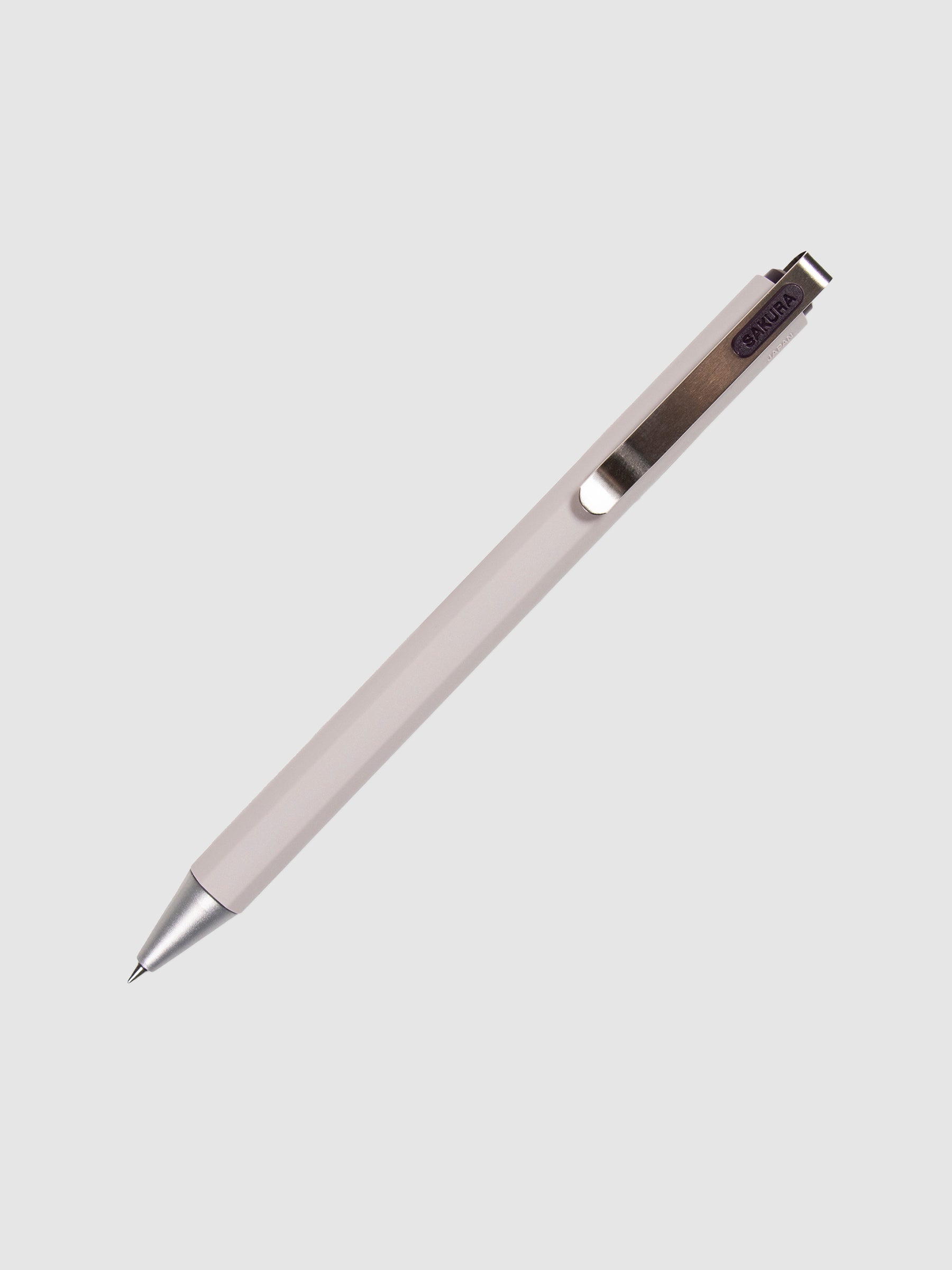 Sakura Ballsign iD Gel Pen, 0.4 mm, Cloth and Paper. Purple black pen turned to the right against a neutral background.