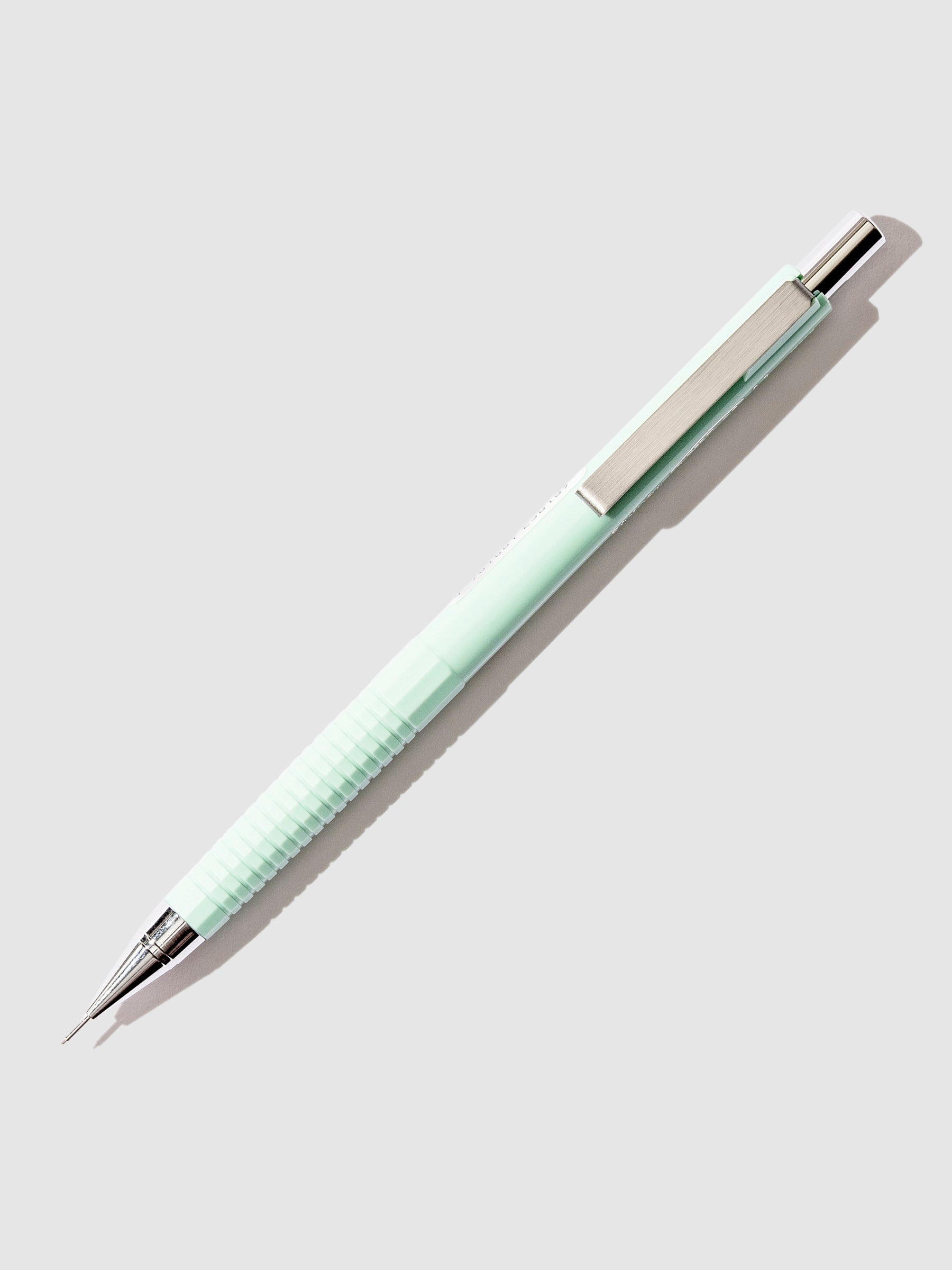 Sakura Craypas Retrico Mechanical Pencil, Cloth and Paper. Mute Green pencil displayed on a  neutral background.