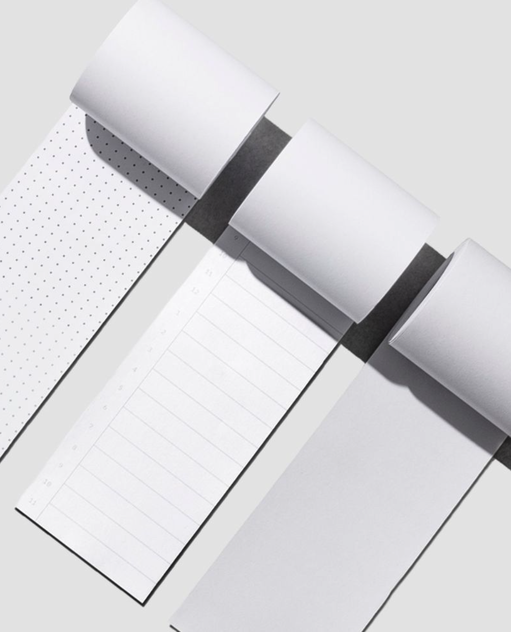 From left to right, the image shows the dot grid, time block, and blank task rolls beside each other.
