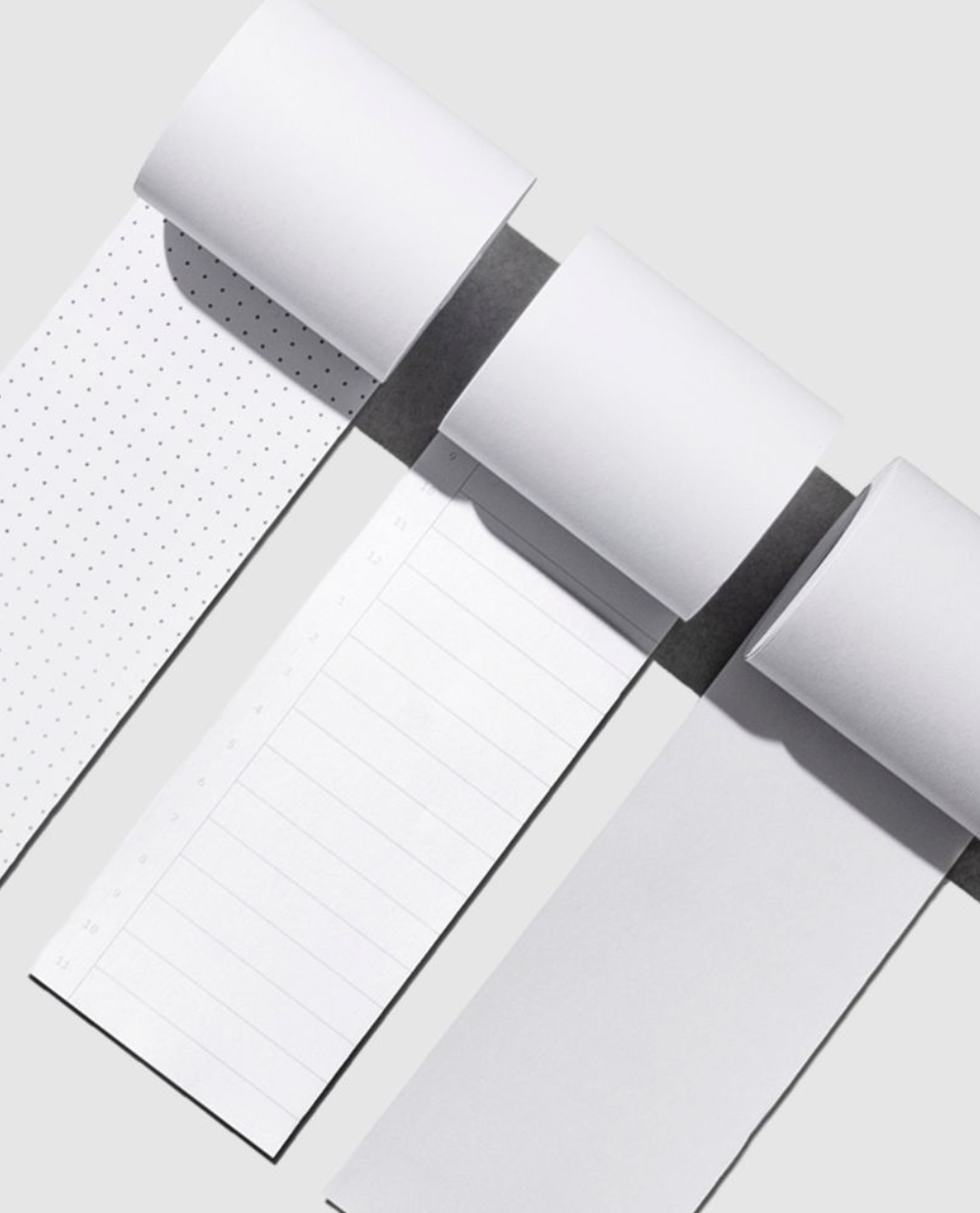 From left to right, the image shows the dot grid, time block, and blank task rolls beside each other.