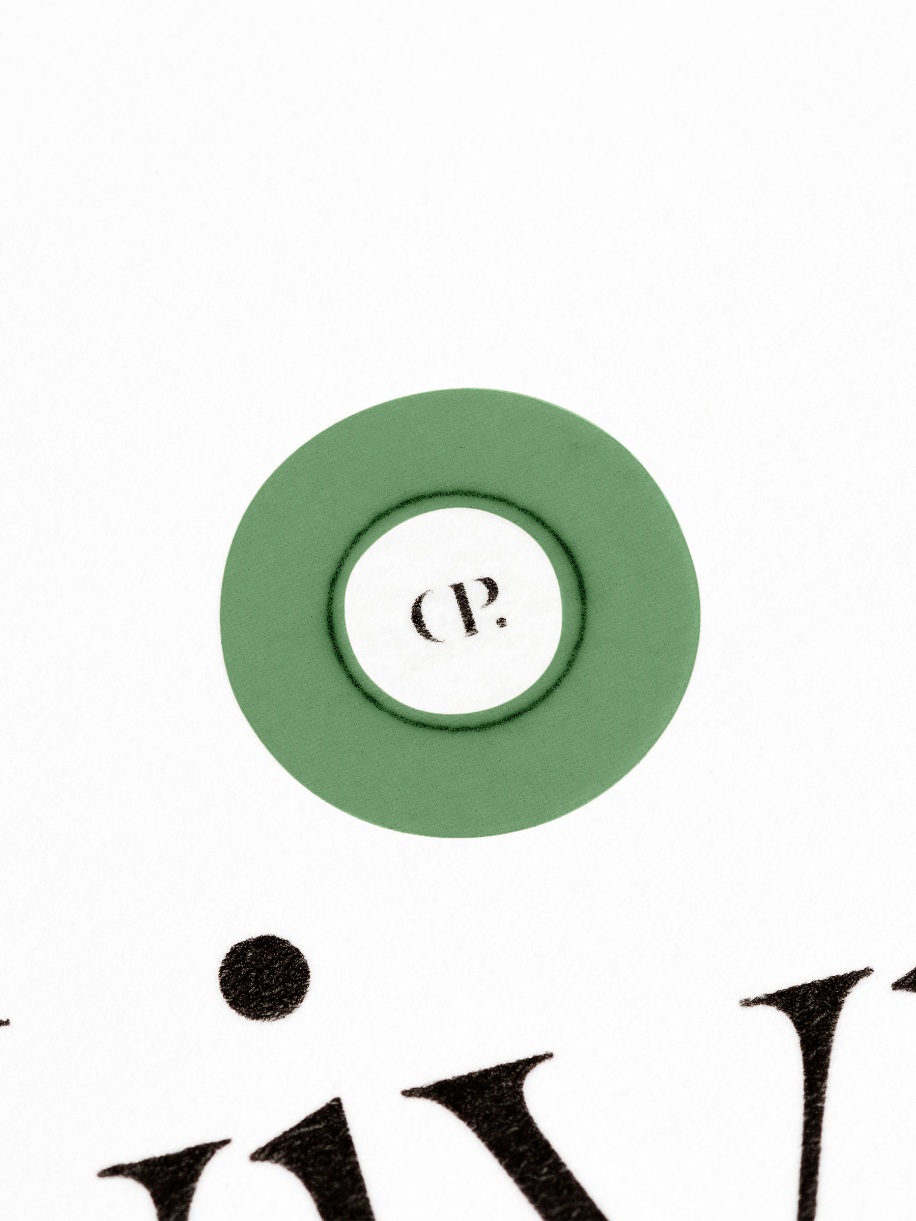 Small sticker in use, placed over the Cloth and Paper logo on a sheet of paper.