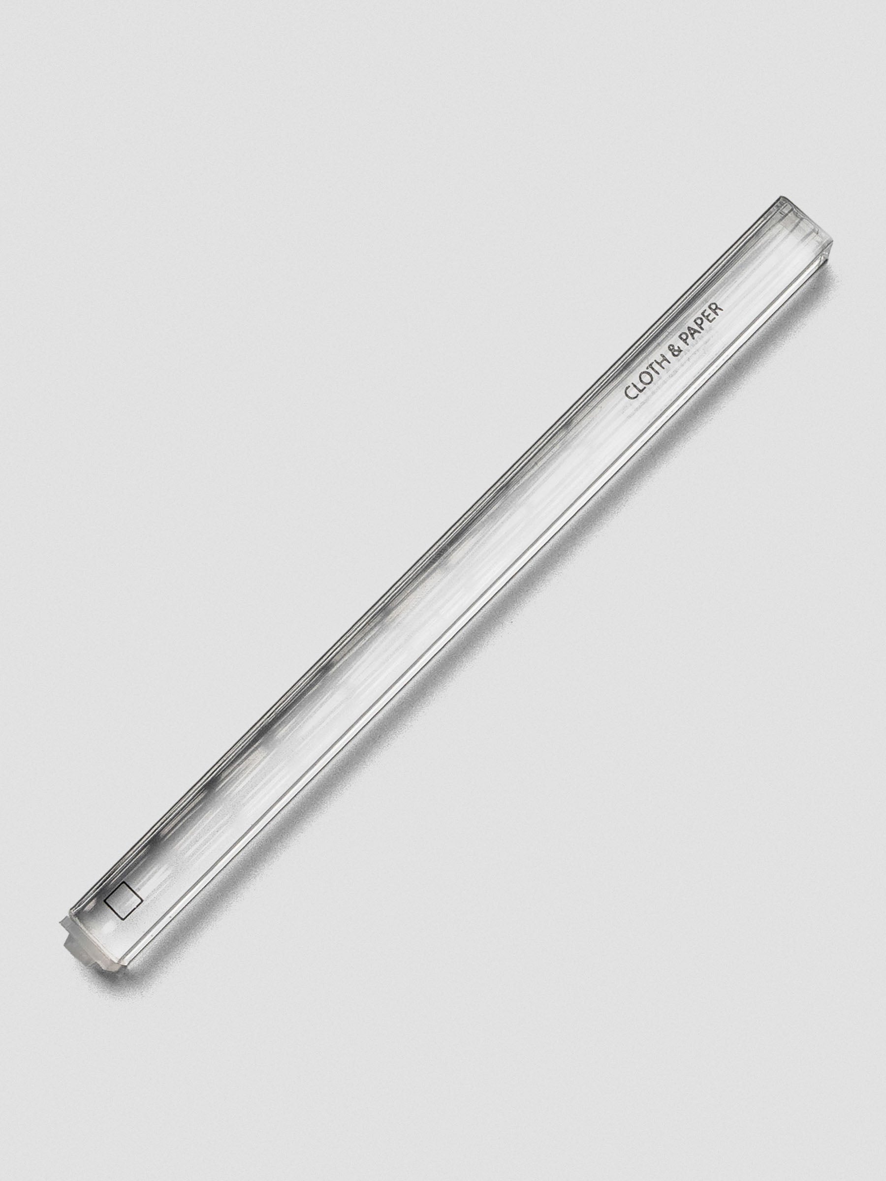 Single clear acrylic stamp stick with an outlined square icon on the end and the Cloth & Paper logo on the side.