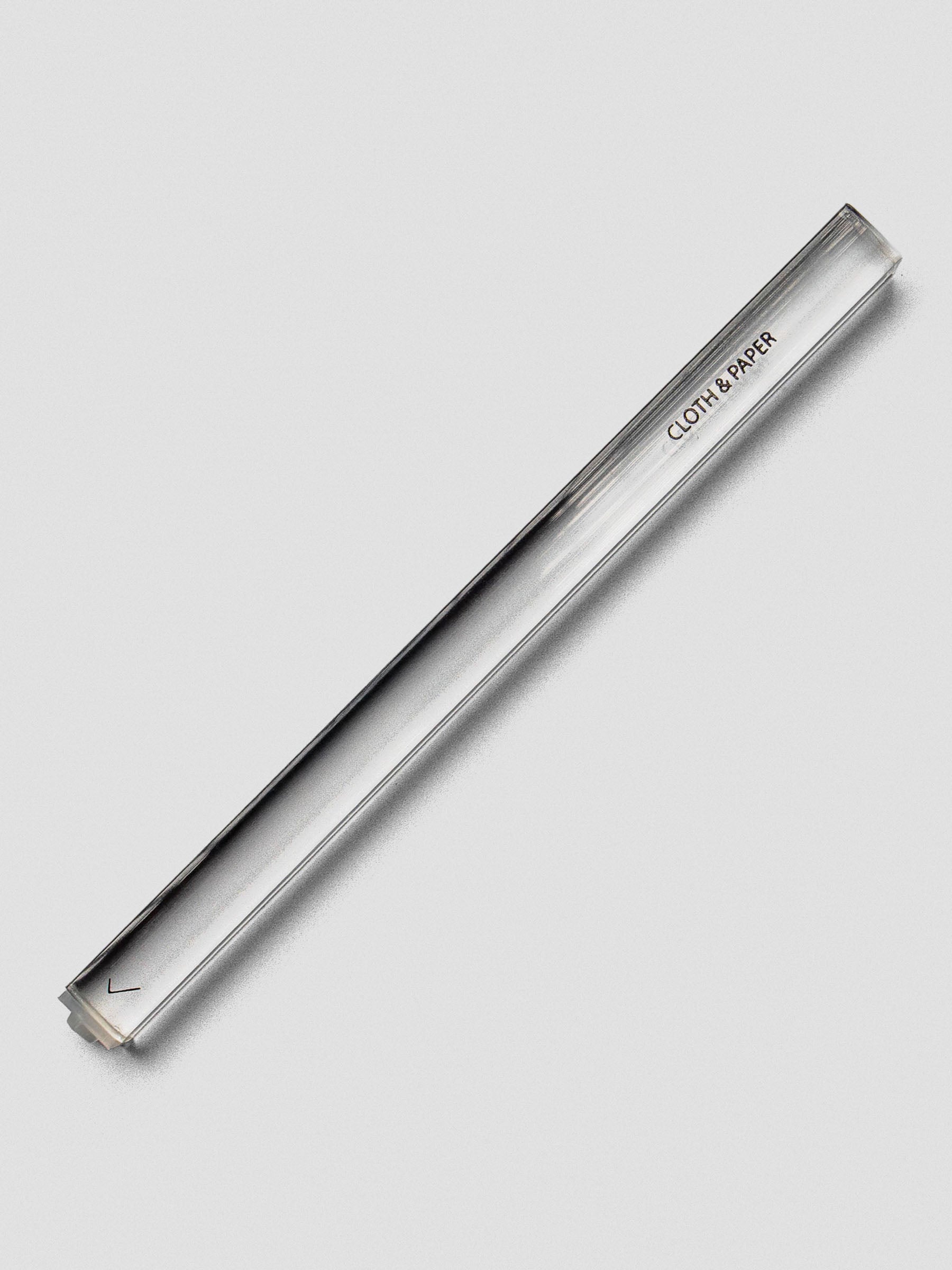 Single clear acrylic stamp stick with a checkmark icon on the end and the Cloth & Paper logo on the side.
