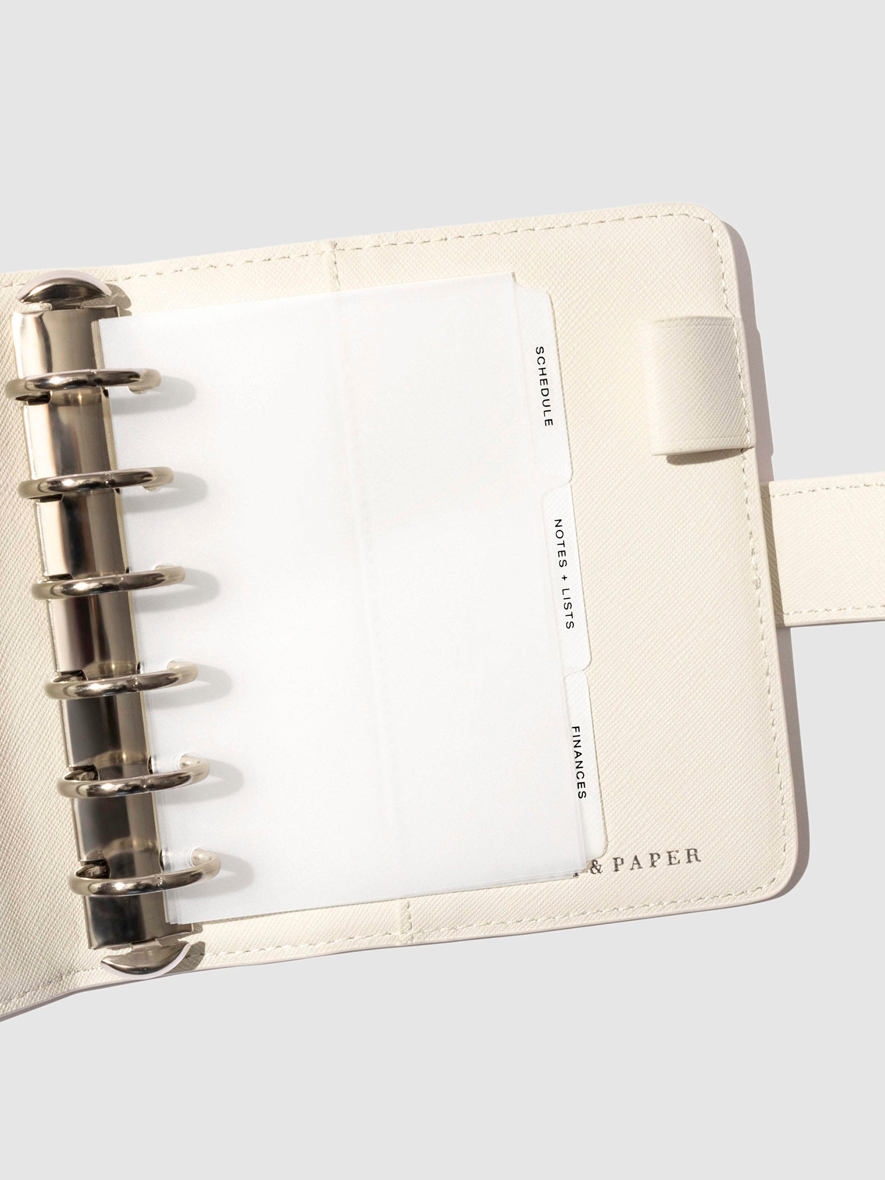 Black foil tabs displayed in use inside a  leather folio.