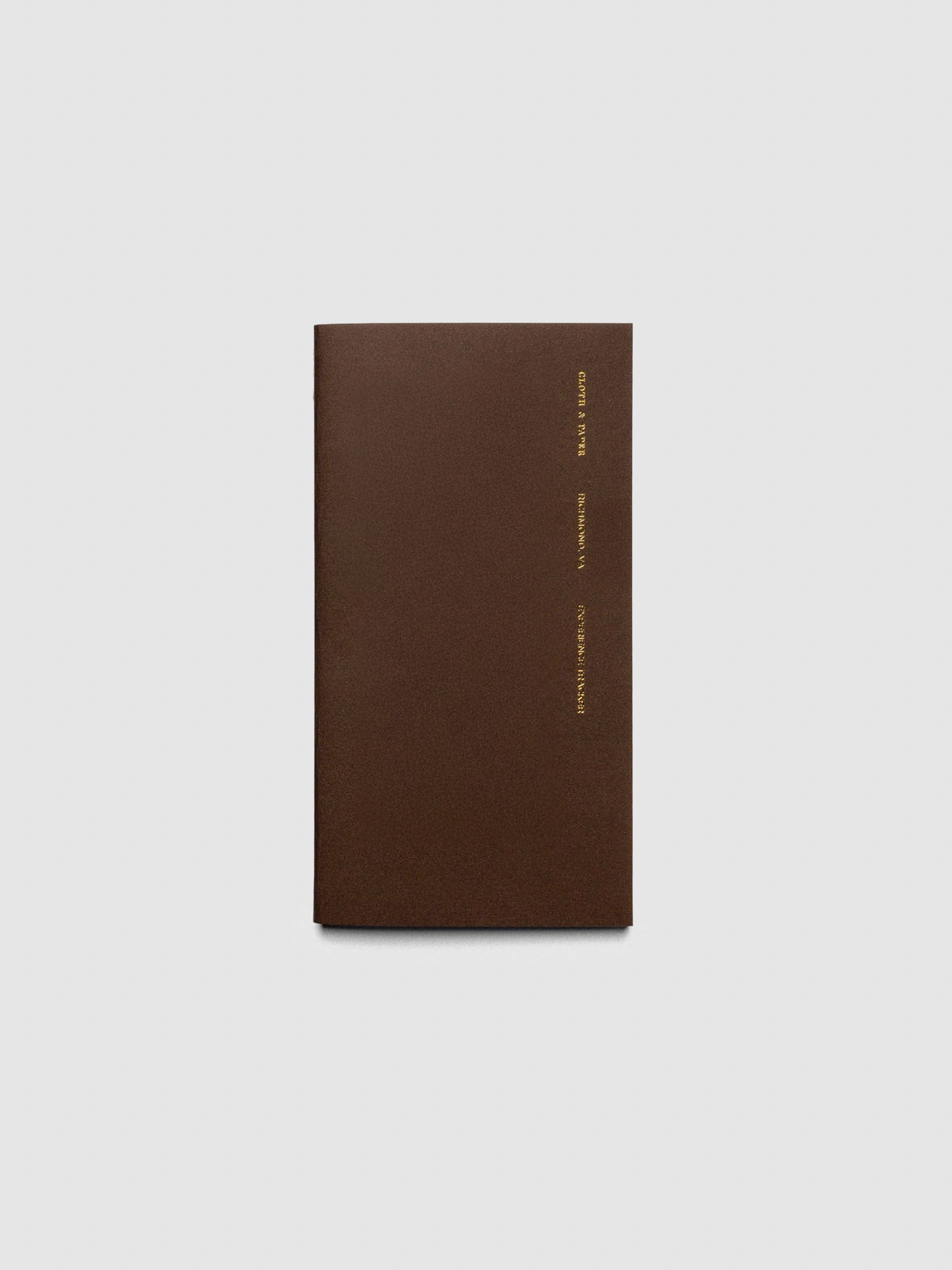 Overview image of the Experience Tracker Walnut Pocket Plus notebook from the Traveler's Notebook Collection. The cover has gold foil text that reads Cloth and Paper Richmond, VA Monthly Admin and is displayed on a neutral background