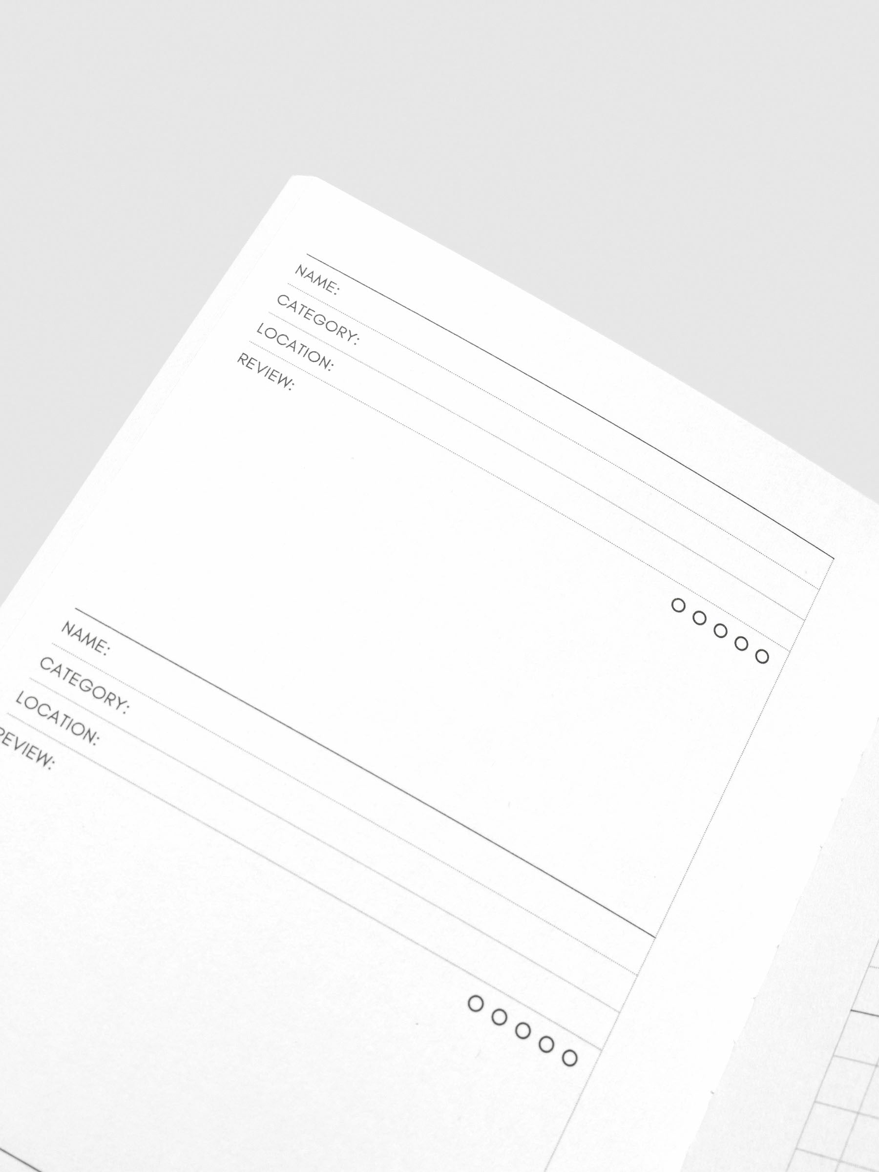 Close up image of the top left of the Experience Tracker Walnut Pocket Plus notebook page. The page is displayed on a neutral background.