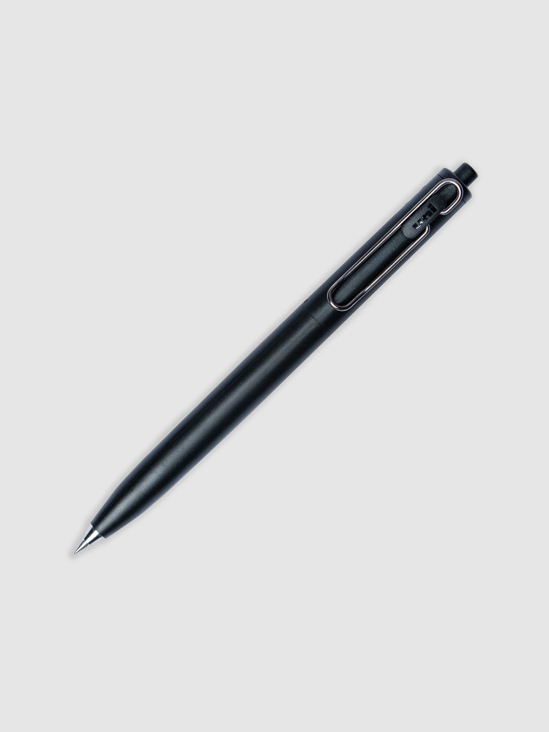 Uni-ball One F Gel Pen with a 0.38 mm nib in Black turned to the right against a neutral background.