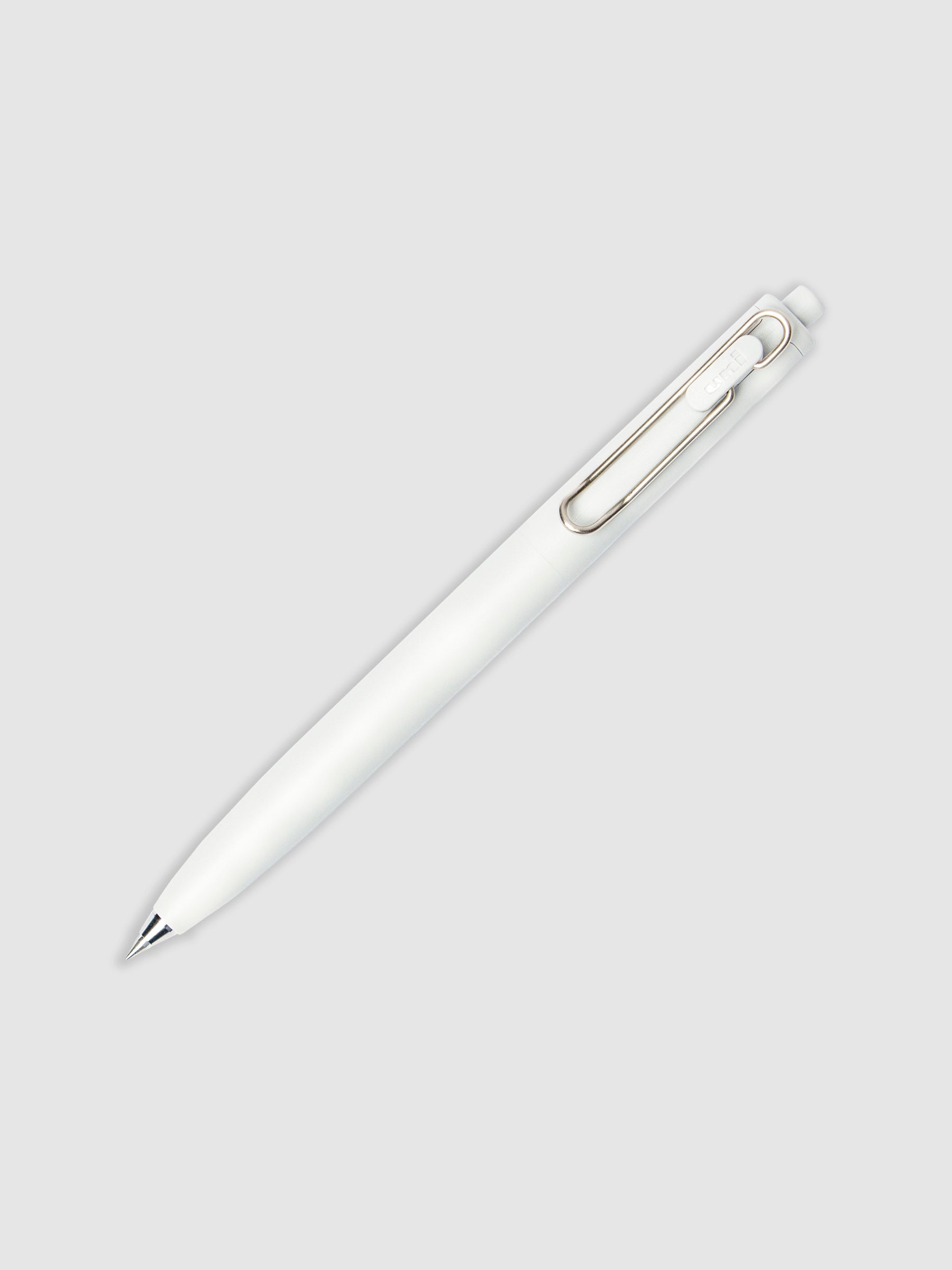 Grey pen turned to the right against a neutral background.