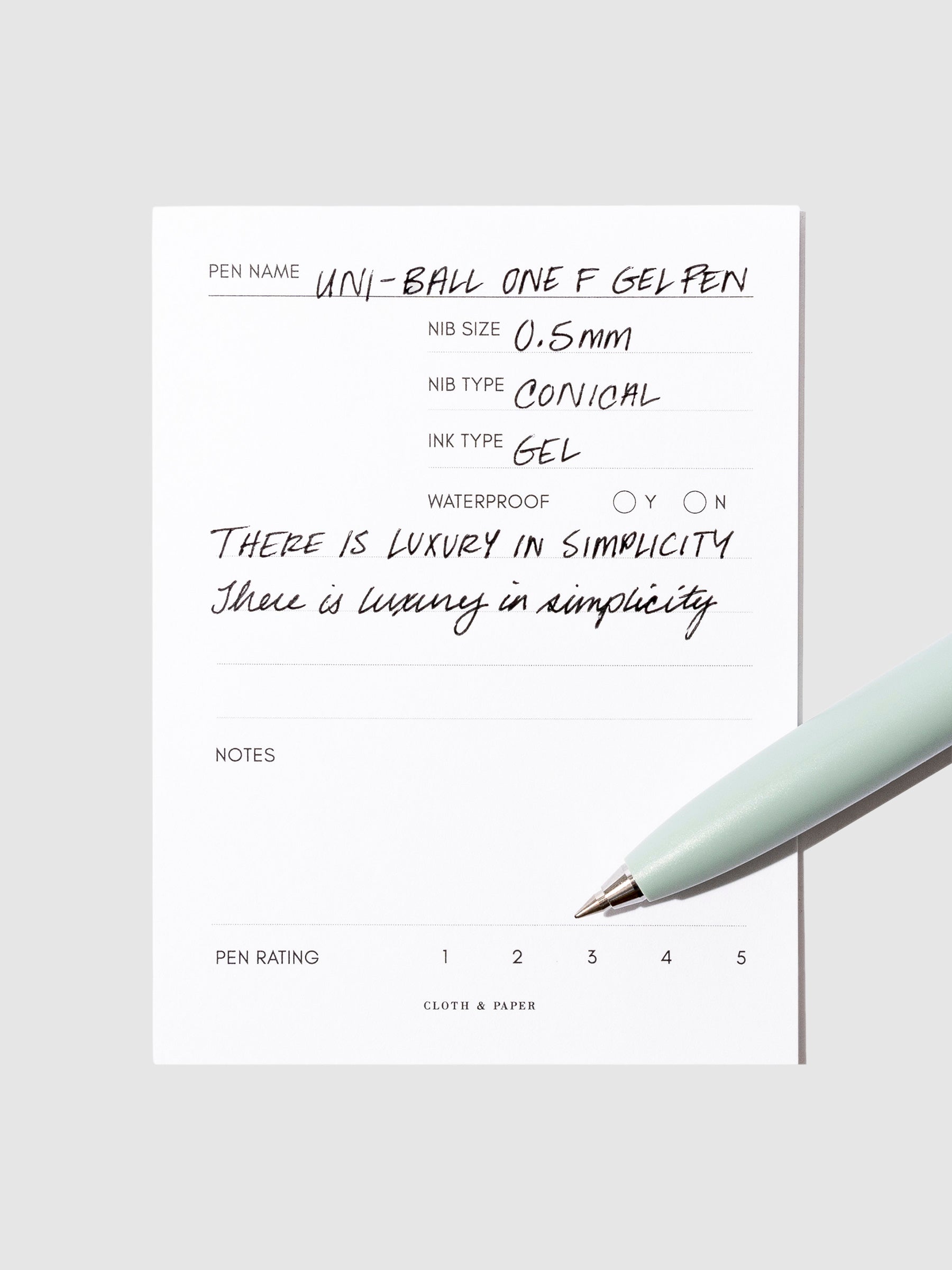 Green  pen resting on an in use pen test sheet.