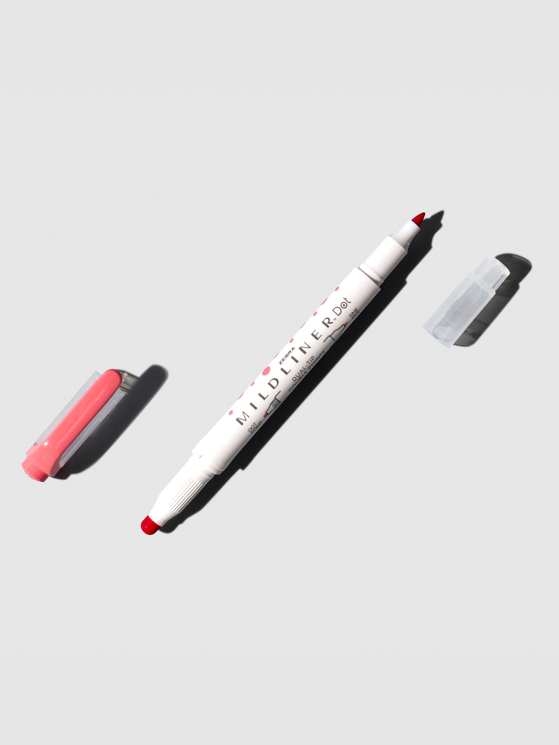 Mildliner highlighter displayed on a neutral background. Color shown is red.