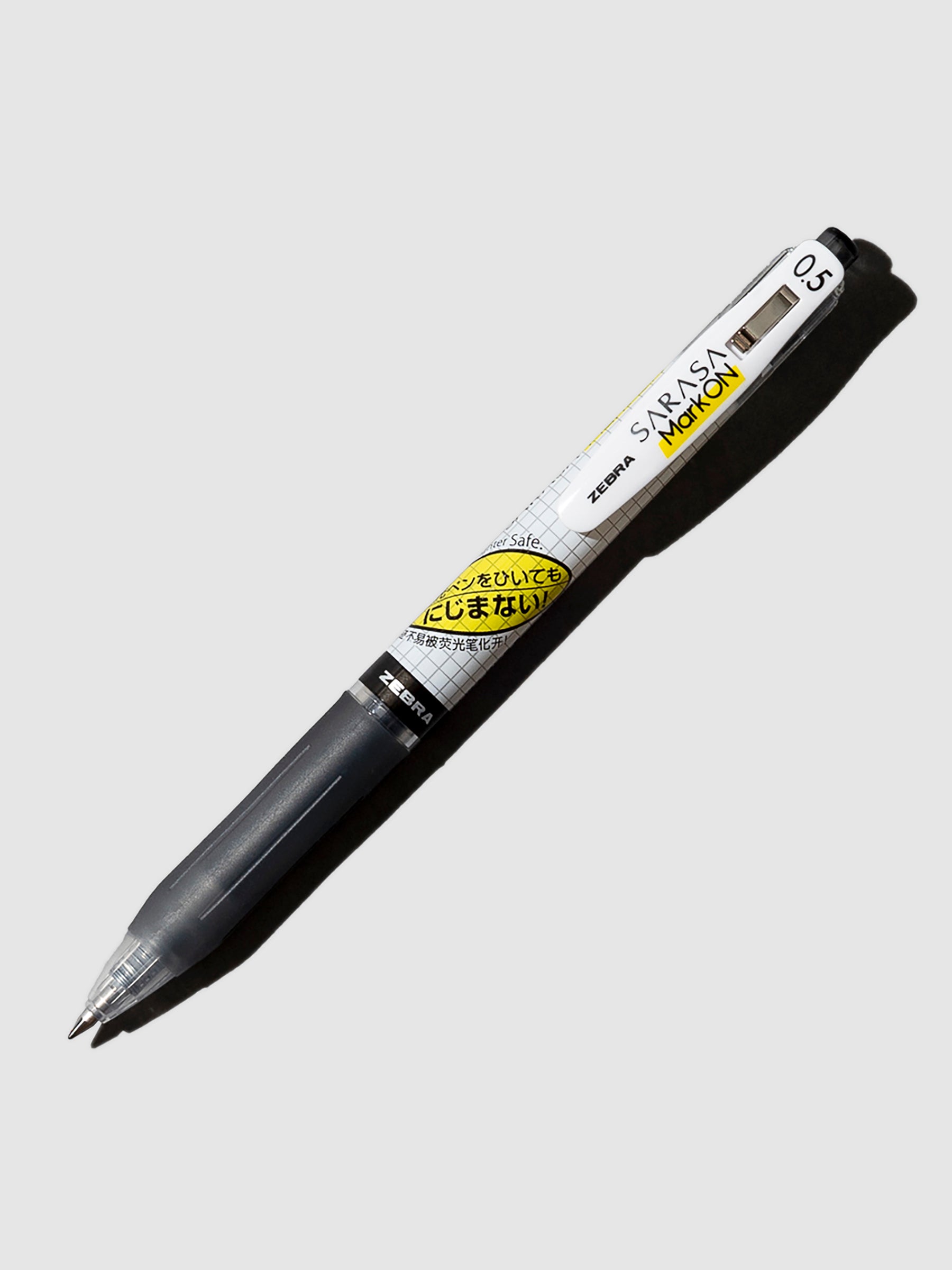 Zebra Sarasa Mark ON Pen in 0.5 mm and Black ink turned to the right against a neutral background.
